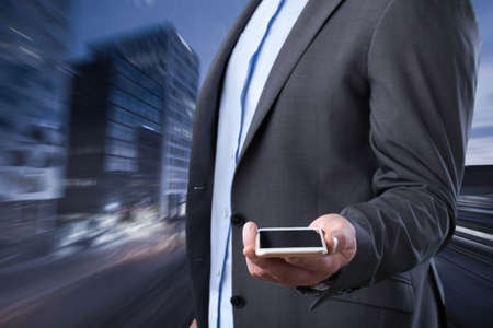 Businessman on city background