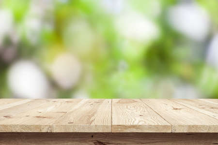 Wooden desk on natural backgroundの写真素材