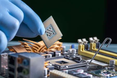 The scientist holds the computer partの写真素材