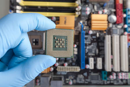 The scientist holds the computer partの写真素材