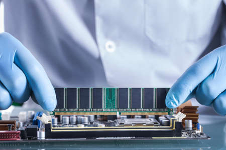 The scientist holds the computer partの写真素材