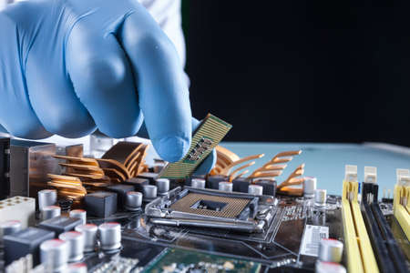 The scientist holds the computer partの写真素材