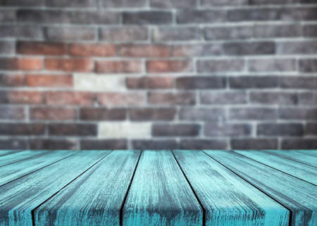 Wooden desk on blur or abstract natural backgroundの写真素材