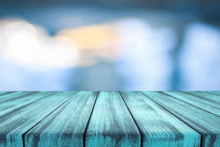 Wooden desk on blur or abstract natural backgroundの写真素材