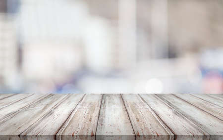 Abstract blur bokeh background with wooden deskの写真素材