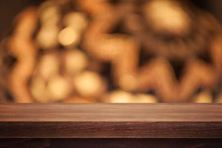 Abstract blur bokeh background with wooden deskの写真素材