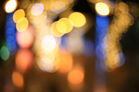 Dark abstract street light shiny bokeh blur backgroundの写真素材