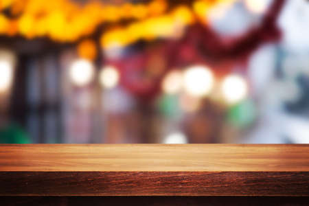 Wooden desk on blur or abstract natural backgroundの写真素材