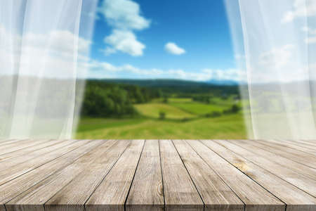 Wooden desk on blur or abstract natural backgroundの写真素材