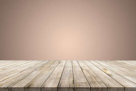 Wooden desk on bokeh blur abstract light backgroundの写真素材