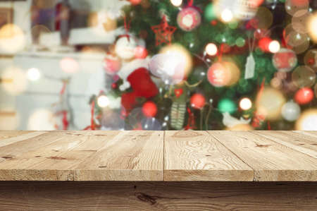 Wooden desk on bokeh blur abstract christmas new year backgroundの写真素材