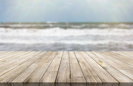 Wooden desk on blur or abstract natural backgroundの写真素材