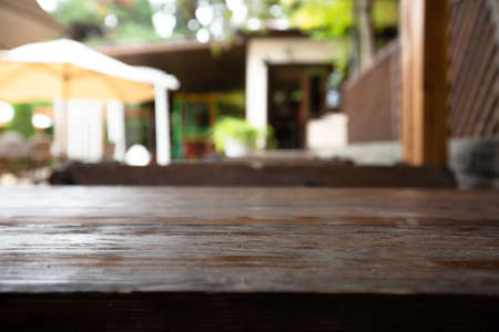 Wooden desk on blur or abstract natural backgroundの写真素材