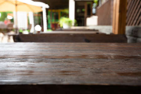 Wooden desk on blur or abstract natural backgroundの写真素材