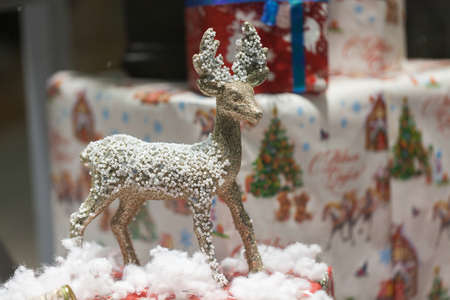 Gift box with ribbon in christmas interior backgroundの写真素材