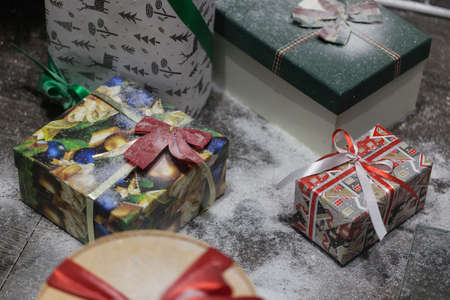 Gift box with ribbon in christmas interior backgroundの写真素材