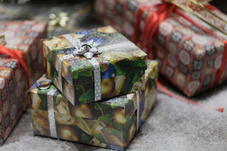 Gift box with ribbon in christmas interior backgroundの写真素材