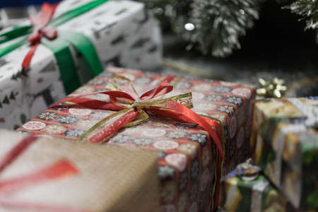 Gift box with ribbon in christmas interior backgroundの写真素材