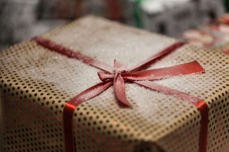 Gift box with ribbon in christmas interior backgroundの写真素材
