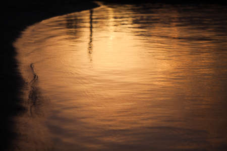 Big sunset water lake with beach background