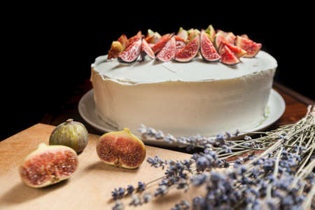 Homemade cheesecake with fresh berries and lavander for dessert on desk