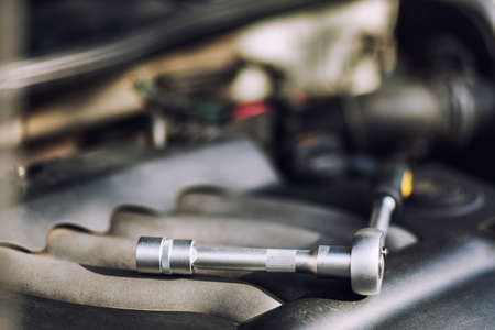 Man master repairs under the hood of the car. Repairing conceptの写真素材