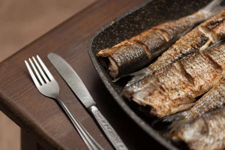 Many Grilled spicy fish on plate. Roasty fish.の写真素材