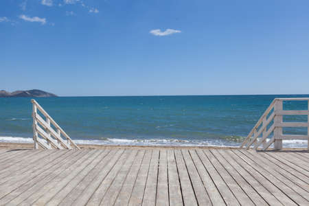 Sea pier natural beach background. Concept table and fon