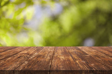 Wooden beautiful table on blurred bokeh background. background conceptの写真素材