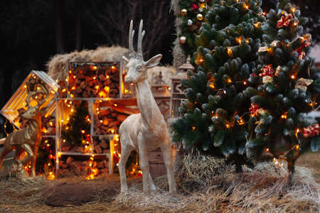 Decorated Christmas with bright balls on blurred sparkling fairy background. Defocused garland lights, Bokeh effect.の写真素材