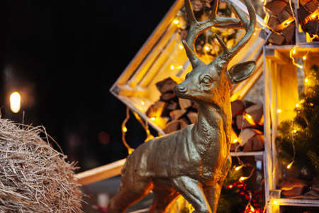 Decorated Christmas with bright balls on blurred sparkling fairy background. Defocused garland lights, Bokeh effect.の写真素材