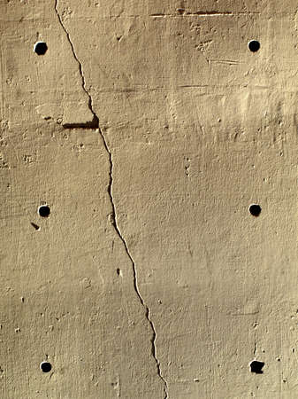 Golden Wall with six holes and a crackの写真素材