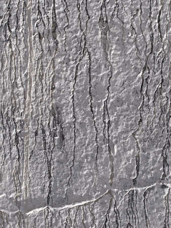 Wall rough gray with metallic shades and cracksの写真素材