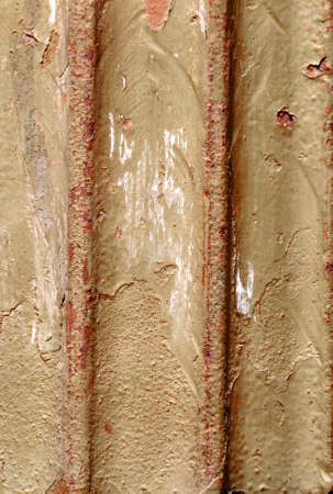 Wall with golden red spots and peeling.の写真素材