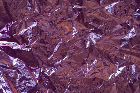 Pink crumpled cellophane paper, high-brightness and hues.の写真素材