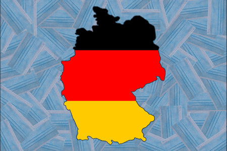 Flag of Germany in the form of a geographical map of Germany against the background of randomly placed blue medical masks. mask mode.の写真素材