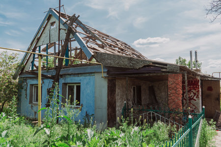 countryside. House destroyed by shelling. War in Ukraine. Russian invasion of Ukraine. Terror of the civilian population. war crimesの写真素材
