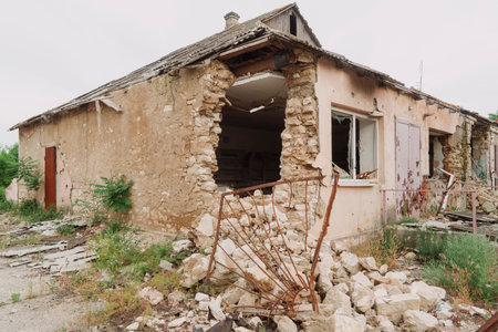 Countryside. A house destroyed by shelling. War in Ukraine. Russian invasion of Ukraine. Destruction of infrastructure. Terror of the civilian population. War crimesの写真素材