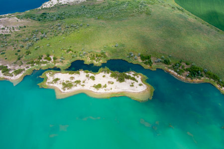 Top view of flooded quarries with white quartz sand. Beautiful artificial lakes with blue water. countryside. drone. Aerial viewの写真素材