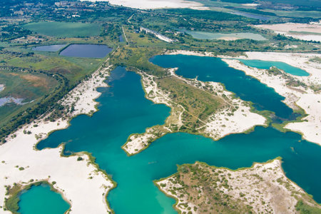 Top view of flooded quarries with white quartz sand. Beautiful artificial lakes with blue water. countryside. drone. Aerial viewの写真素材