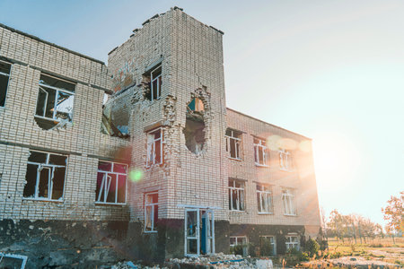 The school was damaged by shelling. War in Ukraineの写真素材