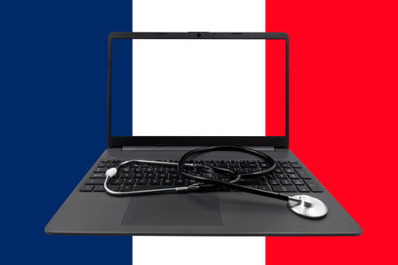 Laptop with a stethoscope on the France flag background. 3D illustrationの写真素材