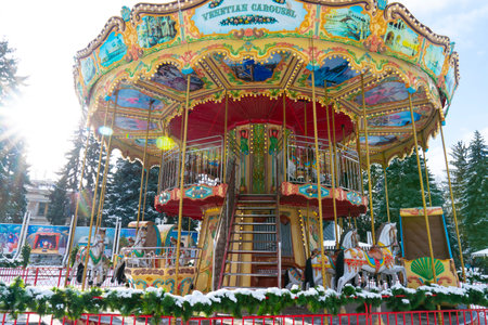 Old vintage retro Venetian carousel in amusement park. Place of rest and leisureの写真素材