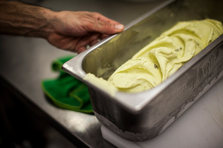 Chef making ice cream in a commercial kitchen. Selective focus.の写真素材