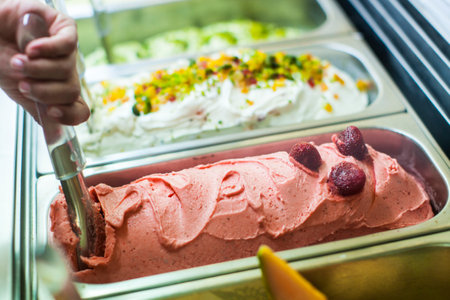 Scoops of ice cream in a metal tray, selective focusの写真素材