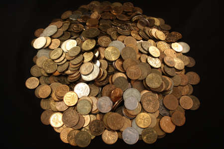 Placer coins on a black background