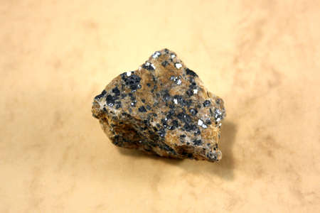 A mineral Galena on a light background