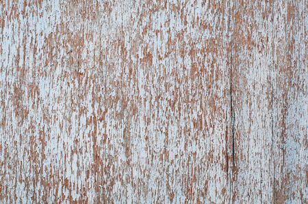 Wooden surface with an old paint peeling blue. Horizontal image.の写真素材
