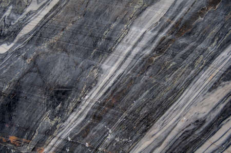 Background. Marble wall of an old abandoned quarry. Texture.