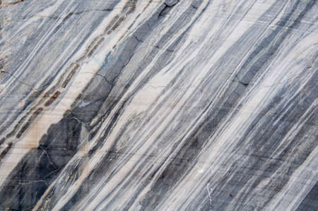 Background. Marble wall of an old abandoned quarry.の写真素材